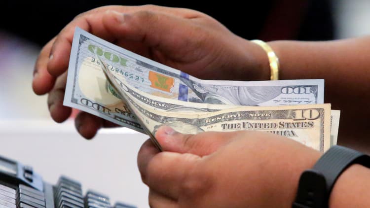 Here's why Americans can't keep money in their pockets — even when they get a raise