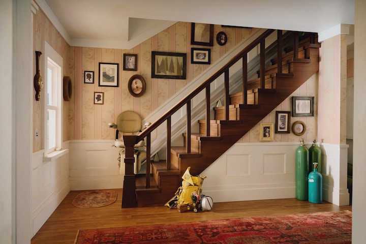 There's some old memories of us to see along the stairs. Oh, and don't mess around with my chair—I'll know. 