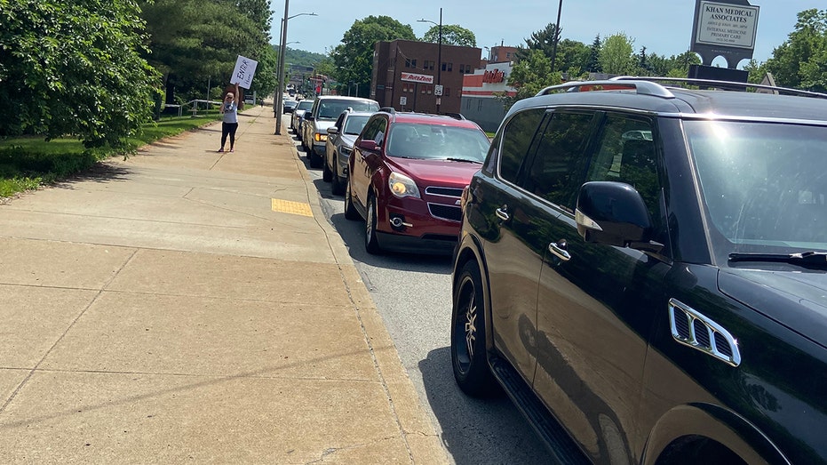 Cars lined up around the corner