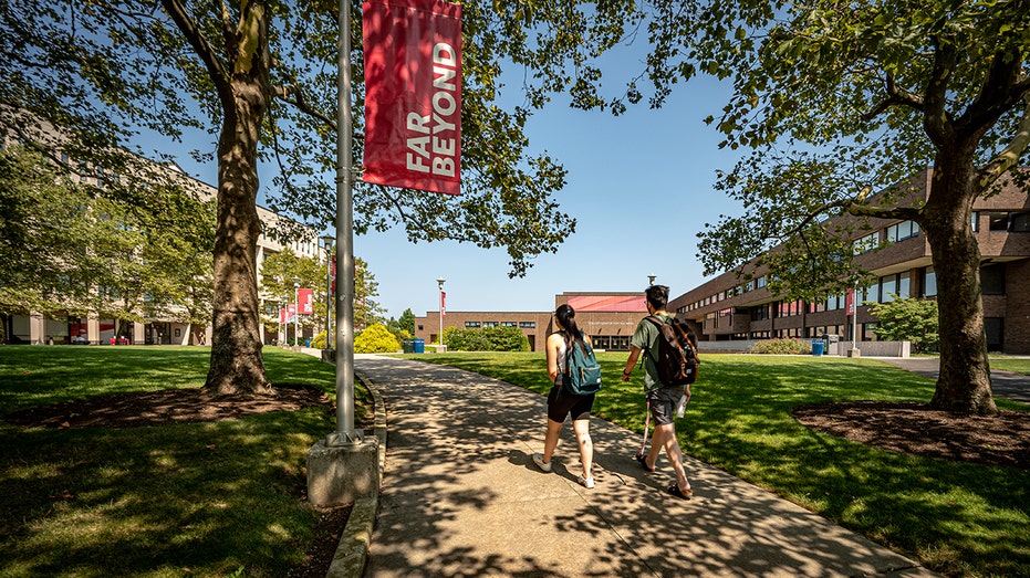 Students walk on college campus