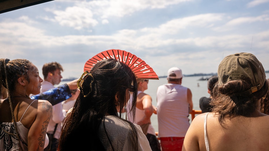 NEW YORK, NEW YORK - JUNE 03: People ride the Staten Island Ferry on a warm late spring afternoon on June 03, 2024 in New York City. As temperatures around the world continue to break yearly heat records, New York City is planning ahead for extreme heat. In one initiative, the New York City Parks Department has planted a record number of trees, 15,000 so far, in neighborhoods that are most at risk from excessive heat. (Photo by Spencer Platt/Getty Images)