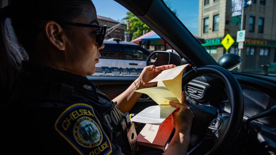 police officer in her vehicle