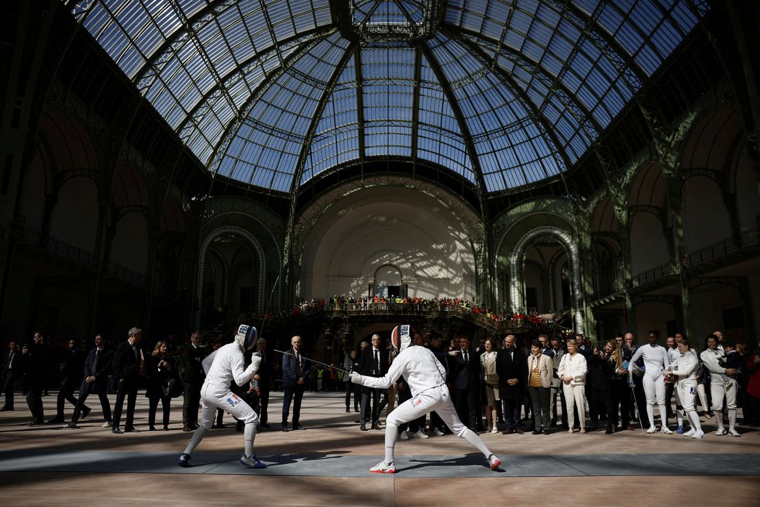 French President Emmanuel Macron attends a demonstration by the French fencing team during his recent visit to the Grand Palais.