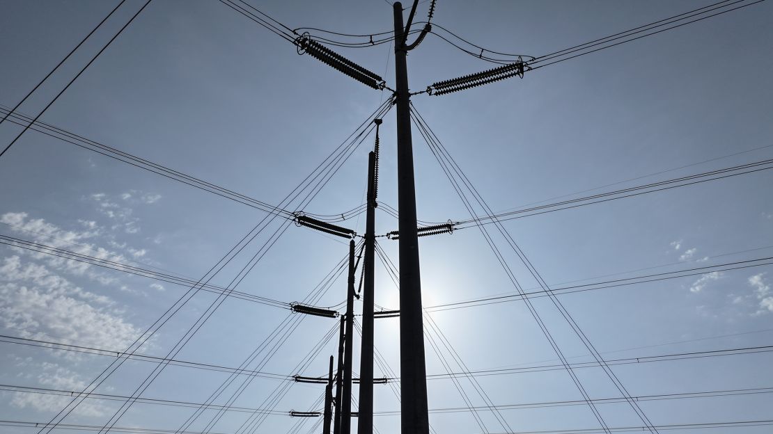 In an aerial view, high voltage power lines run along the electrical power grid on May 16, 2024, in West Palm Beach, Florida.