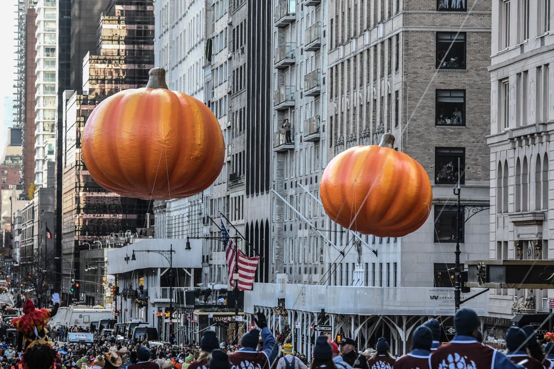 Pumpkin balloons float in Macy's annual Thanksgiving Day Parade on November 23, 2023 in New York City.