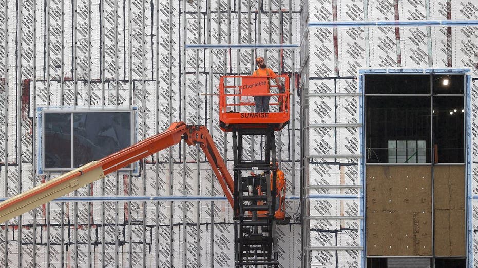 Construction worker in a lift